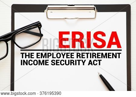 Paper With Employee Retirement Income Security Act Erisa On A Table