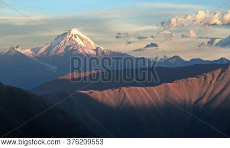 Caucasus Mountains. Kazbek Peak. The Border Of Russia And Georgia.