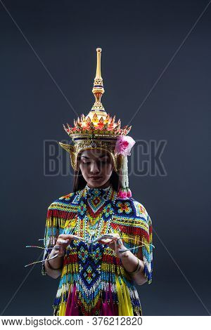 The Beautiful Woman Wearing Thai Southern Folk Dancing Costume,made From Colorful Bead,put Headdress