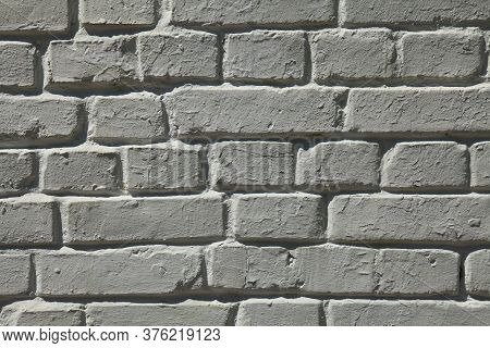 Dim Brick Wall Texture, Background In White Color. The Building Wall, Painted With Whitewased Water-