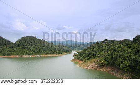 The Reservoir Is Between The Valleys. In The Green Nature On A Clear Day The Sky And Air