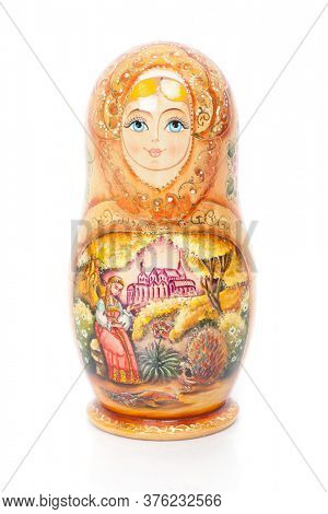 Single Russian nesting doll (also named as Matrioshka) isolated over white background. Wooden doll souvenir.