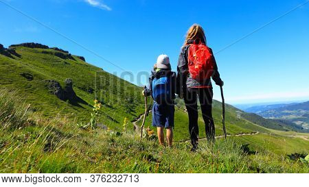 hiking trail, family with backpack- Plomb du Cantal, Auvergne-Cantal