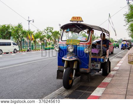 Bangkok, Thailand - January 16, 2020: Traditional Thai Tuc Tuc Taxi Near The Grand Palace.