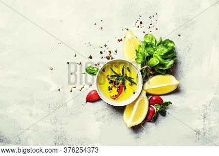 Salad Dressing With Basil, Olive Oil, Garlic, Lemon And Spices, Top View, Food Background