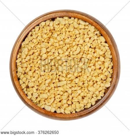 Soya Granules In Wooden Bowl. Textured Soy Protein, Also Called Soy Meat. Defatted Soy Flour Product