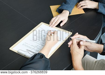 Employer or boss is interviewing for jobs and positions. Woman sitting smiling while submitting a re