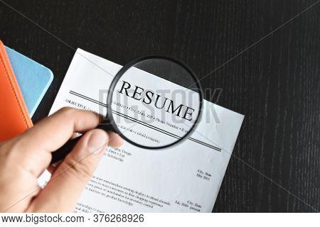Employer Or Boss Is Interviewing For Jobs And Positions. Woman Sitting Smiling While Submitting A Re