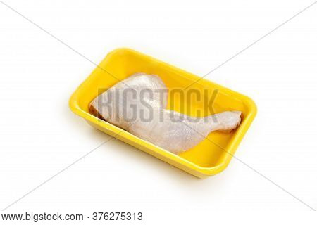 Fresh Raw Chicken Leg In Yellow Foam Isolated In White Background.