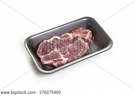 Raw Beef Steaks In The Package Isolated On White Background