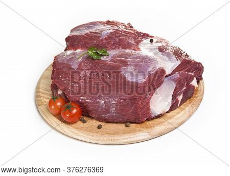 raw beef on the cutting board isolated on the white background