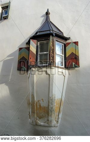 Old Balcony With Multicolored Wooden Windows In The Ancient Village Of Guarda, Scuol Municipality, E