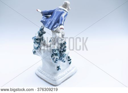 Porcelain Figurine On A White Background.porcelain Figurine On A White Background.
