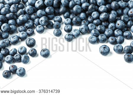Tasty Blueberries Fruit Are Scattered On A White Background. Frame