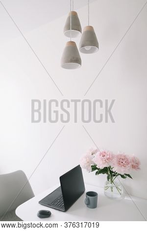 Modern Minimal Interior Design Concept. Home Office Desk Table Workspace With Laptop, Coffee And Flo