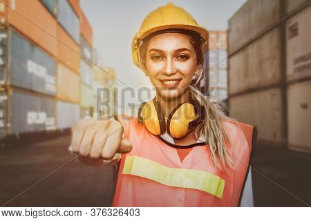 Portrait European Female Workers Wear Earloop, Reduce Noise And Yellow Helmet, Work In The Field, Wa