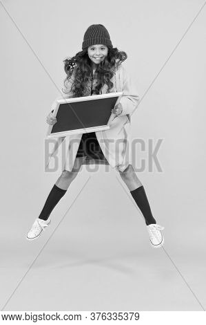 Free After School. Stylish Schoolgirl Blackboard. Copy Space For Ad. Happy Pupil Kid Jumping. Back T