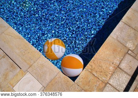 Two Rubber Air Yellow White Inflatable Balls And Toy For Swimming Pool In Transparent Blue Water. Mu