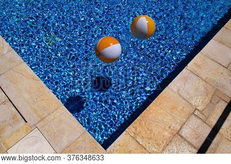 Two Rubber Air Yellow White Inflatable Balls And Toy For Swimming Pool In Transparent Blue Water. Mu