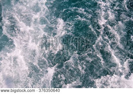 Turbulence Made By Foam Of Sea Water From A High-speed Yacht On Surface Of Sea. Blue Sea Waves With 