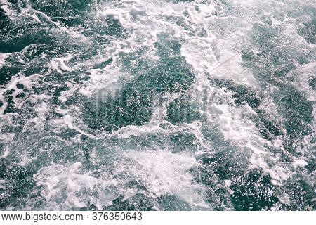 Turbulence Made By Foam Of Sea Water From A High-speed Yacht On Surface Of Sea. Blue Sea Waves With 
