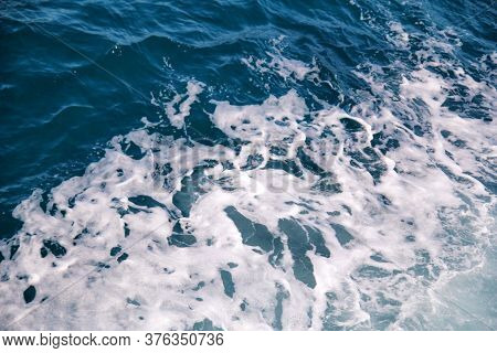 Turbulence Made By Foam Of Sea Water From A High-speed Yacht On Surface Of Sea. Blue Sea Waves With 
