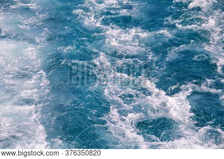Turbulence Made By Foam Of Sea Water From A High-speed Yacht On Surface Of Sea. Blue Sea Waves With 