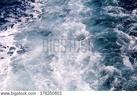 Turbulence Made By Foam Of Sea Water From A High-speed Yacht On Surface Of Sea. Blue Sea Waves With 