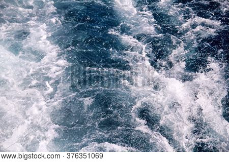 Turbulence Made By Foam Of Sea Water From A High-speed Yacht On Surface Of Sea. Blue Sea Waves With 