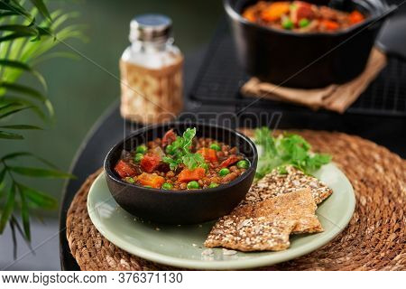Spanish Pardina Lentil And Chorizo Stew With Vegetables On A Table. Selective Focus, Space For Text.
