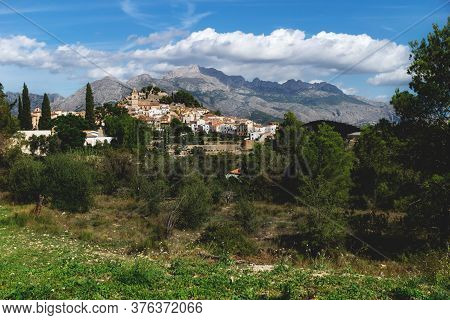 Sunny Panorama View On The Hills Of Polop De Marina Surounded By Green Forest At The Costa Blanca, S
