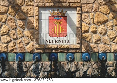 Polop De Marina, Costa Blanca, Spain - 3 Otober 2019: Water Fountains With A Flag Emblem Of Valencia