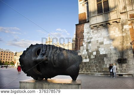 Eros Bendato Head Statue Sculpture Of Krakow Old Town Main Market Square For Polish Or Pole People A