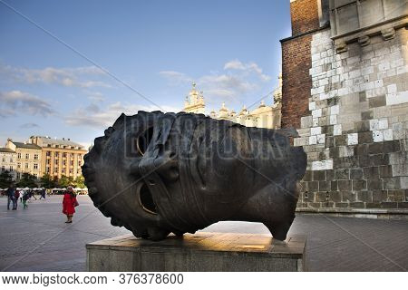 Eros Bendato Head Statue Sculpture Of Krakow Old Town Main Market Square For Polish Or Pole People A