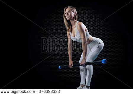 Charming Girl Does An Exercise Called Deadlift. Bodybar. The Concept Of Fitness, Bodybuilding And He