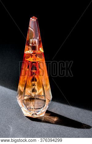 Zhytomyr, Ukraine - June 2, 2020. A Clear Orange Glass Spray Bottle Of Givenchy Ange Ou Demon Le Sec