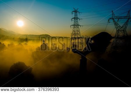 Sun Rays Coming Through The Trees And Electric Towers With Fog Enhancing The Light At Sunrise, Aeria