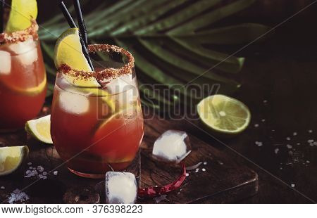 Michelada - Mexican Inspired Bloody Mary Alcoholic Cocktail With Beer, Lime Juice, Tomato Juice, Spi
