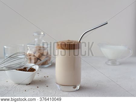 Ingredients For Making Dalgon Coffee In A Glass Bowl. A New Trend In Drinks. Sugar Milk Water Whisk