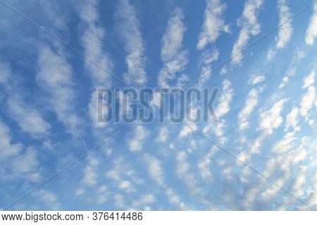 White Clouds And Blue Sky. Beautiful Altocumulus Undulatus Clouds With Blue Sky. Nature Background.