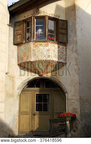 Guarda, Switzerland - Aug 14, 2009: Old House With Frescoed Balcony And Wooden Windows In The Ancien