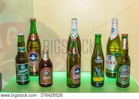 Qingdao / China - August 6, 2015: Different Packaging Of Tsingtao Beer Exhibited At Qingdao Beer Mus