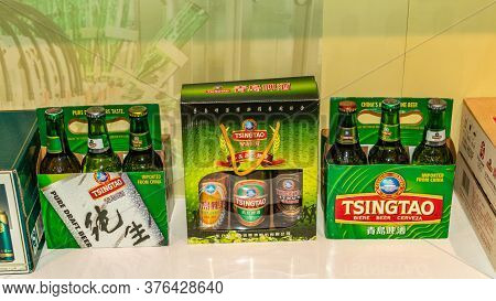 Qingdao / China - August 6, 2015: Different Packaging Of Tsingtao Beer Exhibited At Qingdao Beer Mus
