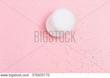 White Plastic Jar Of Facial Moisturizer On Pink Paper Background. Cosmetics For Face. Skincare Produ