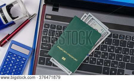 Green Passport On The Keyboard