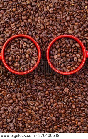 Two Red Cups Full Of Coffee Beans. Fair Trade. Commodity Trade. Fresh Coffee Beans.