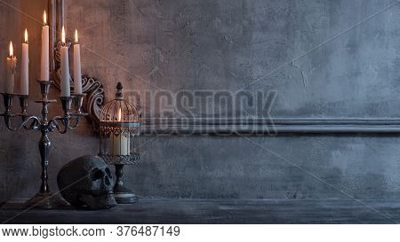 Mystical Halloween Still-life Background. Skull, Candlestick With Candles, Old Fireplace. Horror And