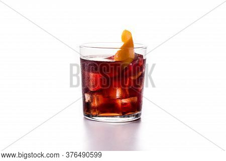 Boulevardier Cocktail And Orange Zest In Glass Isolated On White Background