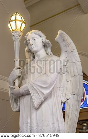 San Antonio, Texas - October 8, 2019 Angel Statue Lamp Stained Glass Saint Mary's Catholic Church Sa