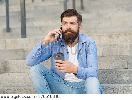Modern Urban Life. Bearded Man Phone Conversation. Mobile Conversation. Coffee Break. Personal Commu